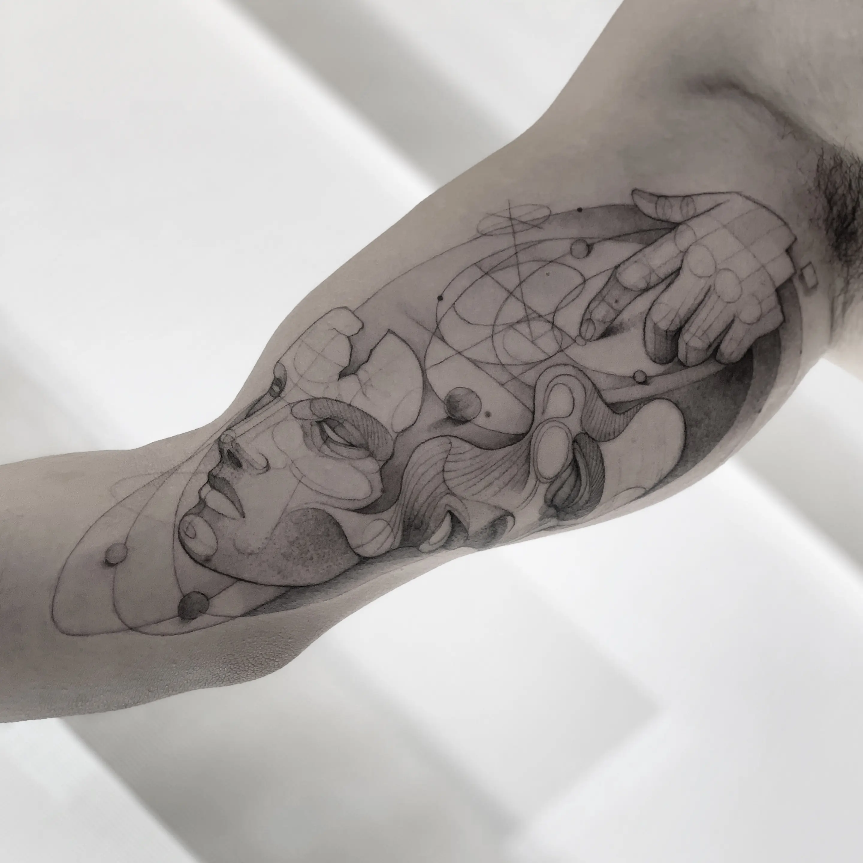 Detailed tattoo artwork by award-winning artist Anibal Franco with intricate line work