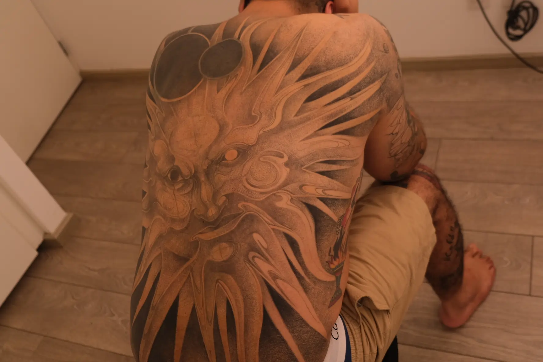 Professional tattoo photography by Anibal Franco featuring detailed surrealist artwork